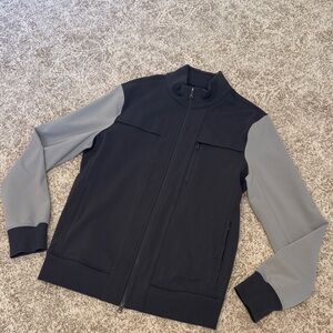 Men's charcoal and light gray zipped jacket.